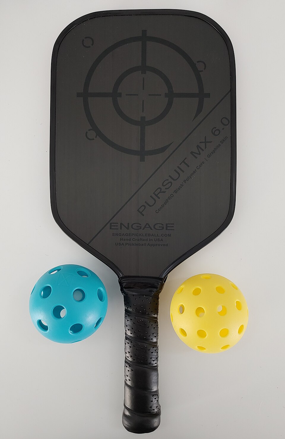 Collection of pickleball paddles and balls for beginners